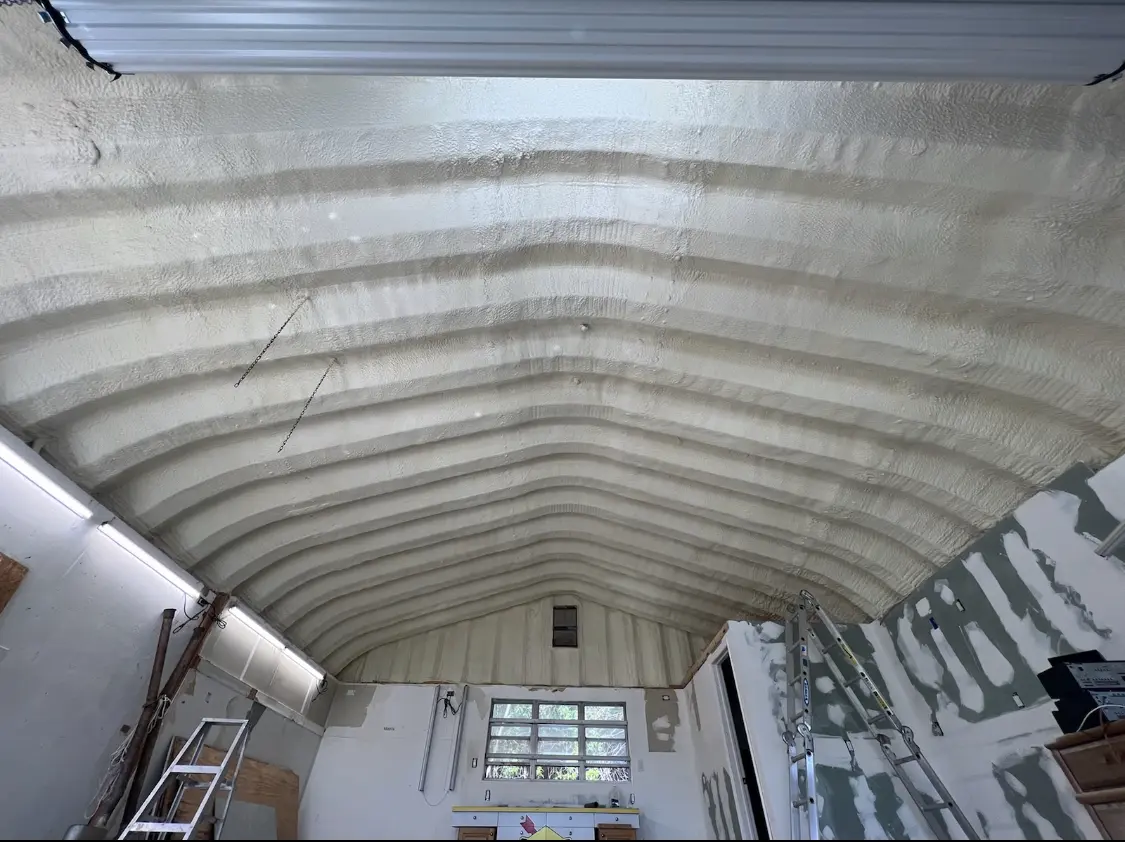 Spray polyurethane foam applied to the underside of a metal roof deck in Archdale